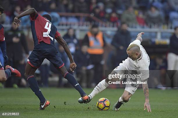 Radja Nainggolan of AS Roma and Isaac Cofie of Genoa CFC compete for the ball during the Serie A match between Genoa CFC and AS Roma at Stadio Luigi...