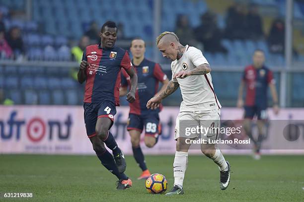 Radja Nainggolan of AS Roma and Isaac Cofie of Genoa CFC compete for the ball during the Serie A match between Genoa CFC and AS Roma at Stadio Luigi...