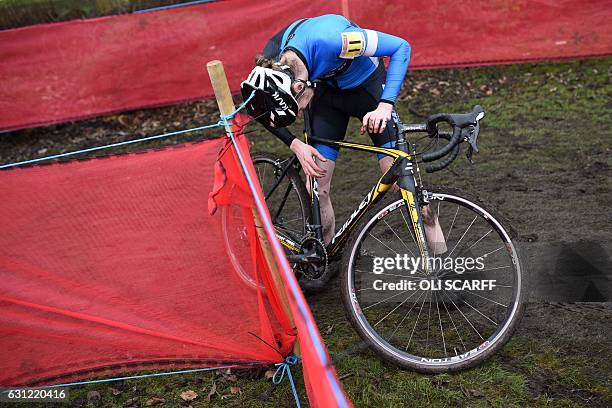 Rider David Beachill attempts to repair his bike during the Elite Men's Championship on the second day of the 2017 British Cycling National...