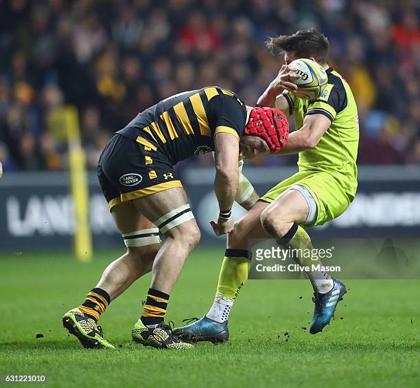 James Haskell of Wasps sustains a head injury as he tackles Freddie Burns of Leicester during the Aviva Premiership match between Wasps and Leicester...