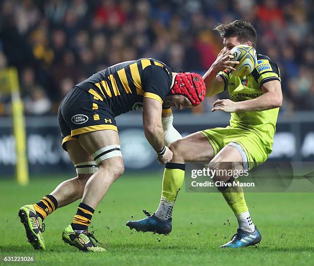 James Haskell of Wasps sustains a head injury as he tackles Freddie Burns of Leicester during the Aviva Premiership match between Wasps and Leicester...