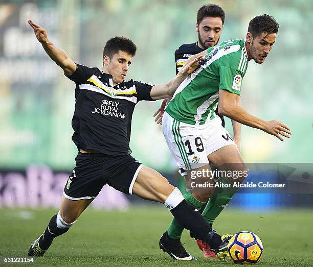 Alex Alegria of Real Betis Balompie being followed by Unai Bustinza during La Liga match between Real Betis Balompie v CD Leganes at Benito...