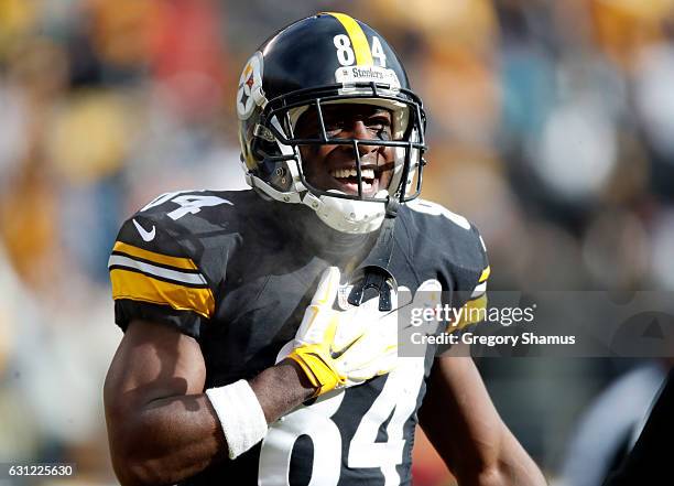 Antonio Brown of the Pittsburgh Steelers celebrates after scoring his second touchdown during the first quarter against the Miami Dolphins in the AFC...