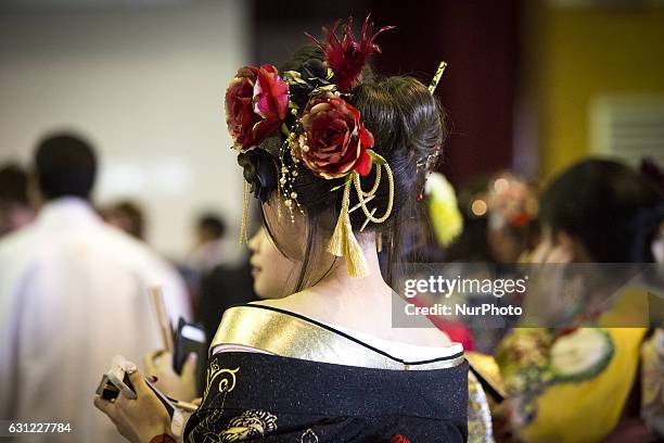 New adults in kimonos attend a Coming of Age Day celebration ceremony in Shuri Junior High School in Okinawa, Japan on January 8, 2017. The Coming of...