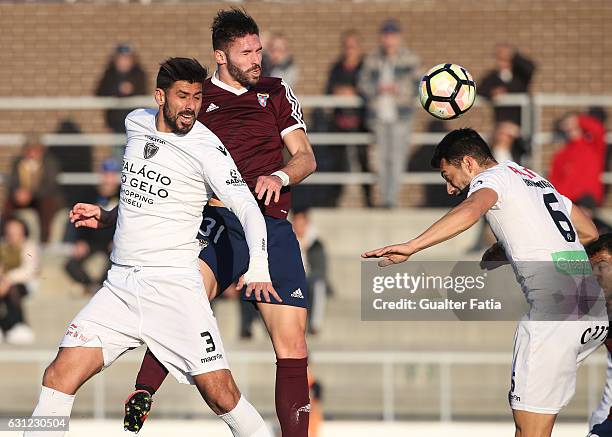 Ricardo Barros of CD Cova da Piedade with Bura of AC Viseu and Bruno Miguel of AC Viseu in action during the Segunda Liga match between CD Cova da...