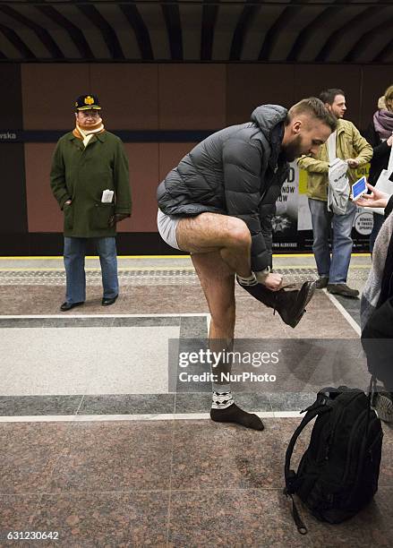 People without pants ride an underground train on January 8, 2017 in Warsaw, Poland. The annual event, called 'No Pants Day,' is a whimsical Facebook...