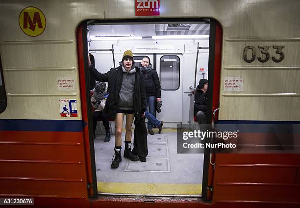 People without pants ride an underground train on January 8, 2017 in Warsaw, Poland. The annual event, called 'No Pants Day,' is a whimsical Facebook...