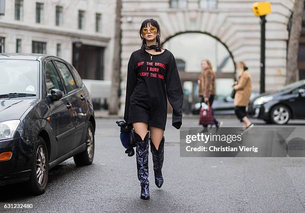 Betty Bachz wearing a Vetements sweater May the bridges I burn light the way, a MCM bunny bag Rabbit Cross Body Bag, Moy Atelier sunglasses during...