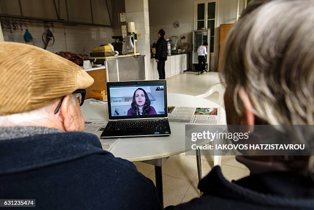 Maria Kyriakou speaks with her father Iakovos Savva and brother Kyriakos Kyriakou, who are all members of a Greek-Cypriot family who fled their home...