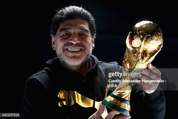 Diego Maradona of Argentina poses with the FIFA World Cup trophy prior to The Best FIFA Football Awards at Kameha Zurich Hotel on January 8, 2017 in...