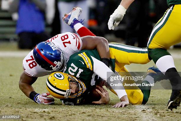 Romeo Okwara of the New York Giants sacks Aaron Rodgers of the Green Bay Packers in the second quarter during the NFC Wild Card game at Lambeau Field...