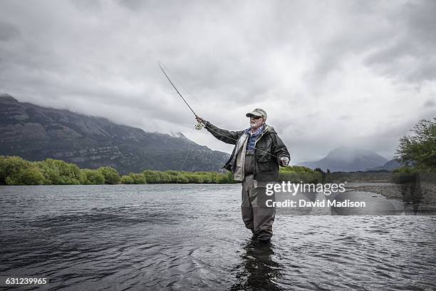 man fly fishing in patagonia - 漁業 ストックフォトと画像