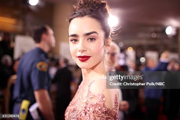 74th ANNUAL GOLDEN GLOBE AWARDS -- Pictured: Actress Lily Collins arrives to the 74th Annual Golden Globe Awards held at the Beverly Hilton Hotel on...