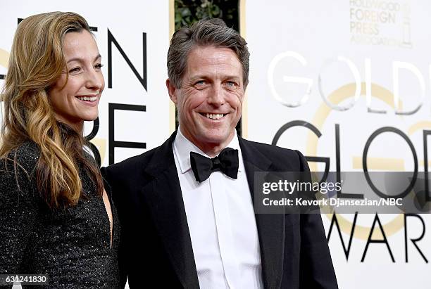 74th ANNUAL GOLDEN GLOBE AWARDS -- Pictured: Producer Anna Elisabet Eberstein and actor Hugh Grant arrive to the 74th Annual Golden Globe Awards held...