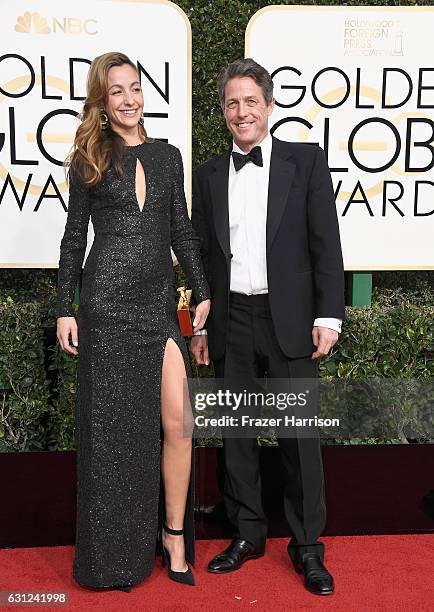 Actor Hugh Grant and producer Anna Elisabet Eberstein attend the 74th Annual Golden Globe Awards at The Beverly Hilton Hotel on January 8, 2017 in...