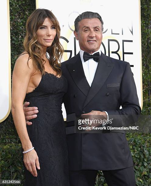 74th ANNUAL GOLDEN GLOBE AWARDS -- Pictured: Model Jennifer Flavin and actor Sylvester Stallone arrive to the 74th Annual Golden Globe Awards held at...
