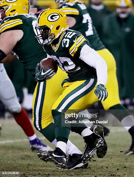 Christine Michael of the Green Bay Packers runs with the ball in the third quarter during the NFC Wild Card game against the New York Giants at...
