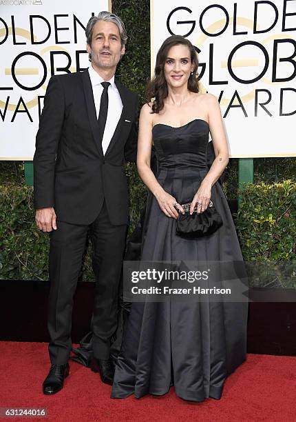 Actress Winona Ryder and Scott Mackinlay Hahn attend the 74th Annual Golden Globe Awards at The Beverly Hilton Hotel on January 8, 2017 in Beverly...