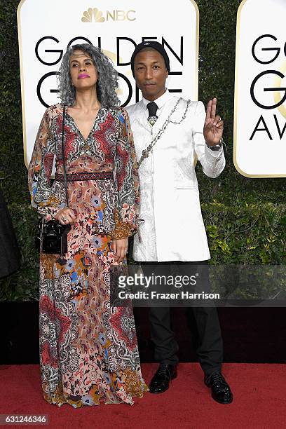 Musician Pharrell Williams and Mimi Valdes attend the 74th Annual Golden Globe Awards at The Beverly Hilton Hotel on January 8, 2017 in Beverly...