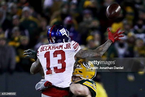 Jake Ryan of the Green Bay Packers breaks up a pass intended for Odell Beckham of the New York Giants in the fourth quarter during the NFC Wild Card...