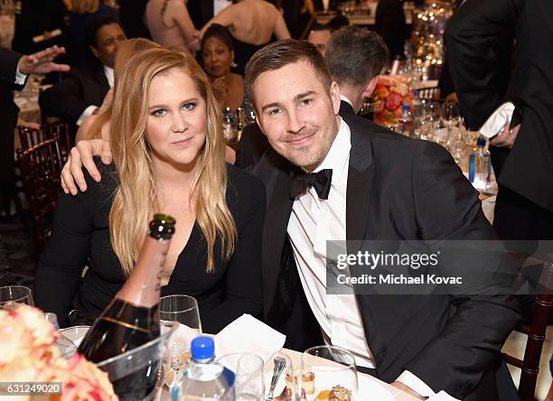 Actress Amy Schumer and Ben Hanisch attend the 74th Annual Golden Globe Awards at The Beverly Hilton Hotel on January 8, 2017 in Beverly Hills,...