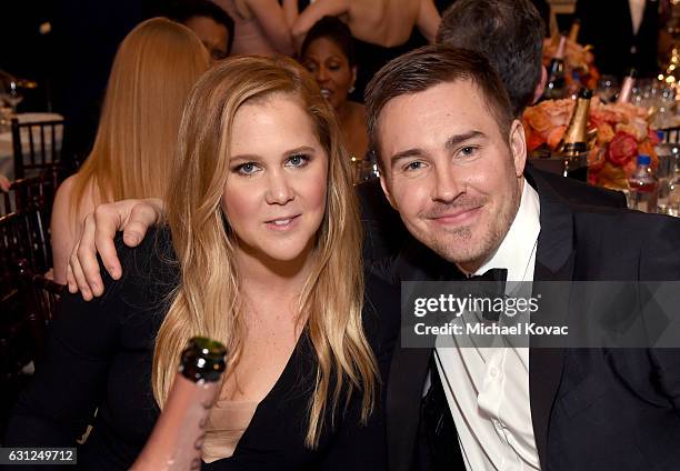Actress Amy Schumer and Ben Hanisch attend the 74th Annual Golden Globe Awards at The Beverly Hilton Hotel on January 8, 2017 in Beverly Hills,...