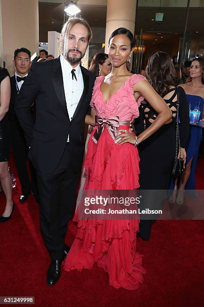 Artist Marco Perego and actress Zoe Saldana at the 74th annual Golden Globe Awards sponsored by FIJI Water at The Beverly Hilton Hotel on January 8,...