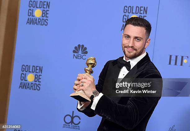 Actor Aaron Taylor-Johnson, winner of Best Supporting Actor in a Motion Picture for 'Nocturnal Animals,' poses in the press room during the 74th...