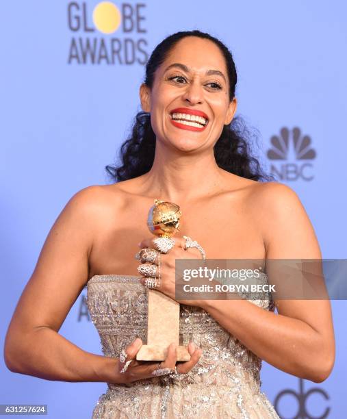 Tracee Ellis Ross poses with the award for Best Actress in a Comedy TV series for her role in "Black-ish," in the press room at the 74th annual...