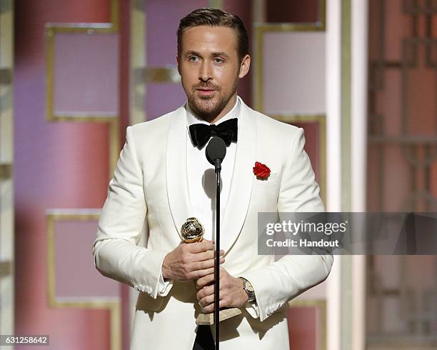 In this handout photo provided by NBCUniversal, Ryan Gosling accepts the award for Best Actor in a Motion Picture - Musical or Comedy for his role in...