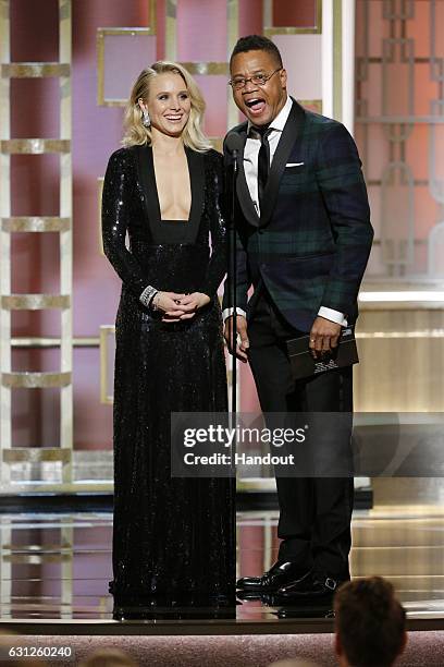 In this handout photo provided by NBCUniversal, presenters Kristen Bell and Cuba Gooding Jr. Onstage during the 74th Annual Golden Globe Awards at...