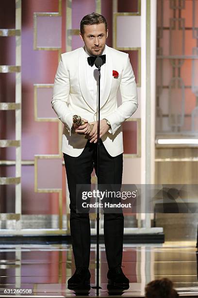 In this handout photo provided by NBCUniversal, Ryan Gosling accepts the award for Best Actor in a Motion Picture - Musical or Comedy for his role in...