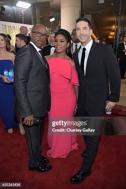 Actors Courtney B. Vance , Angela Bassett and David Schwimmer at the 74th annual Golden Globe Awards sponsored by FIJI Water at The Beverly Hilton...