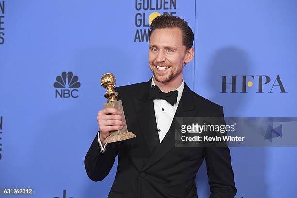 Actor Tom Hiddleston, winner of Best Actor in a Miniseries or Television Film for 'The Night Manager,' poses in the press room during the 74th Annual...