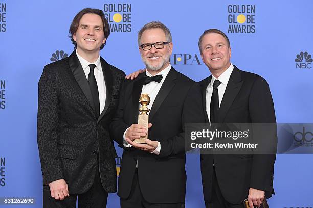 Directors Byron Howard and Rich Moore and producer Clark Spencer, winners of Best Animated Feature Film for 'Zootopia,' pose in the press room during...