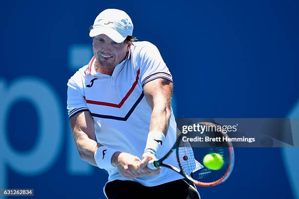 Matthew Barton of Australia plays a backhand shot in his first round match against Kyle Edmund of Great Britain during day two of the 2017 Sydney...