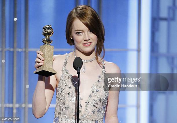 In this handout photo provided by NBCUniversal, Emma Stone accepts the award for Best Actress in a Motion Picture - Musical or Comedy for her role in...