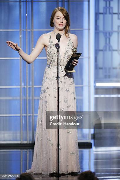 In this handout photo provided by NBCUniversal, Emma Stone accepts the award for Best Actress in a Motion Picture - Musical or Comedy for her role in...