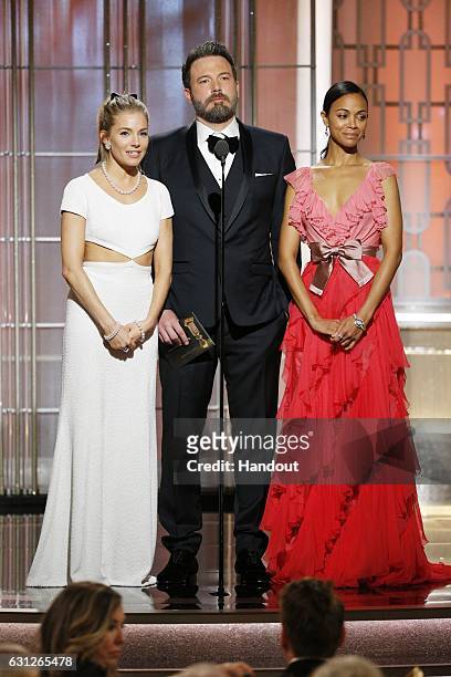 In this handout photo provided by NBCUniversal, presenters Sienna Miller, Ben Affleck and Zoe Saldana onstage during the 74th Annual Golden Globe...