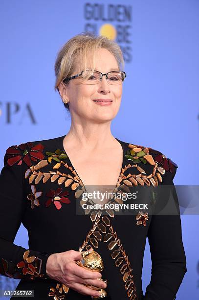 Actress Meryl Streep poses with The Cecil B. DeMille Award in the press room during the 74th Annual Golden Globe Awards at The Beverly Hilton Hotel...