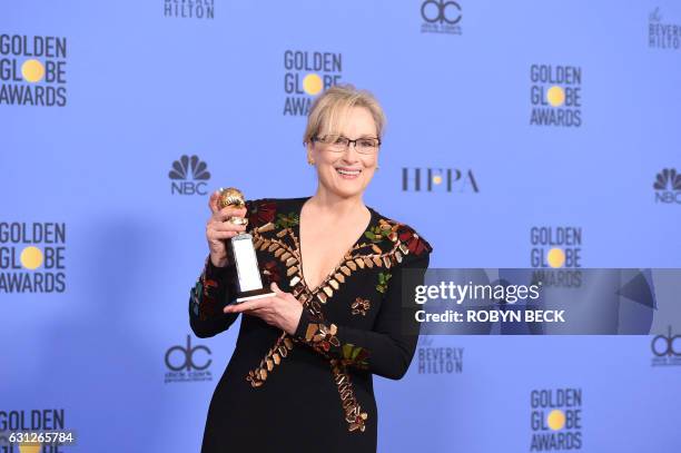 Actress Meryl Streep poses with The Cecil B. DeMille Award in the press room during the 74th Annual Golden Globe Awards at The Beverly Hilton Hotel...