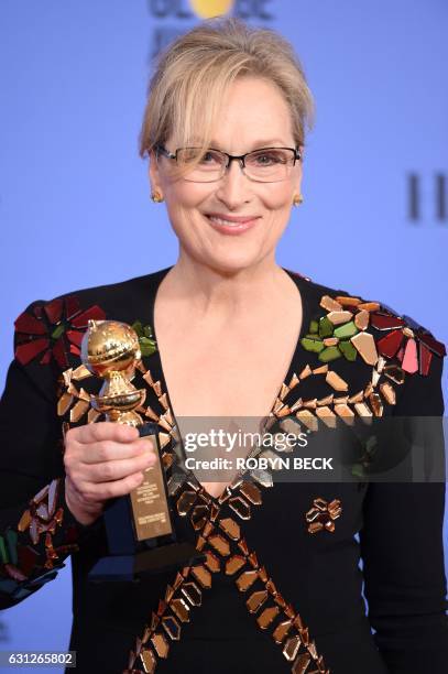 Actress Meryl Streep poses with The Cecil B. DeMille Award in the press room during the 74th Annual Golden Globe Awards at The Beverly Hilton Hotel...