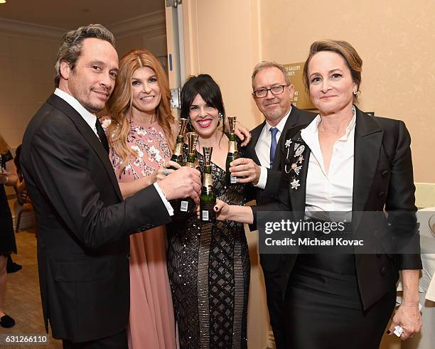 Producer D.V. DeVincentis, actress Connie Britton, producers Alexis Martin Woodall, Nina Jacobson attend the 74th Annual Golden Globe Awards at The...