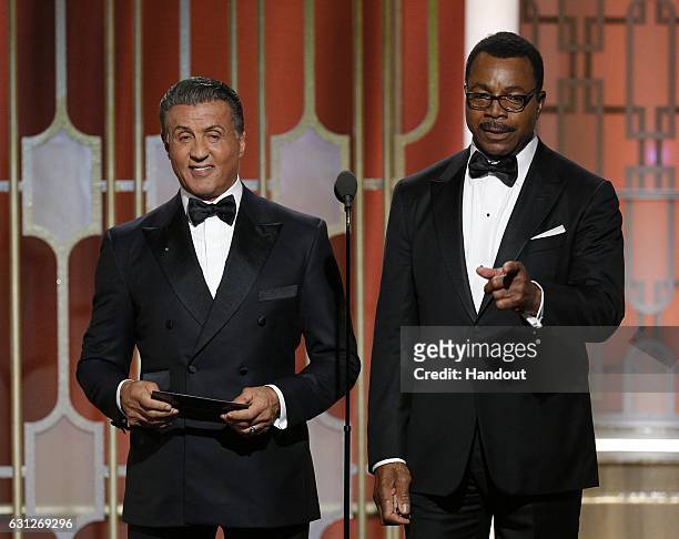 In this handout photo provided by NBCUniversal, Sylvester Stallone and Carl Weathers, who co-starred in the 1977 Golden Globe Award-winning film...