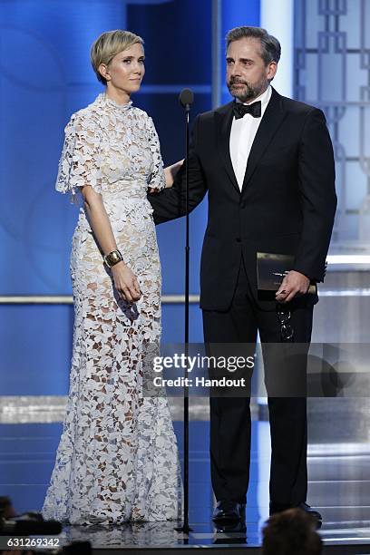 In this handout photo provided by NBCUniversal, presenters Kristen Wiig and Steve Carell onstage during the 74th Annual Golden Globe Awards at The...