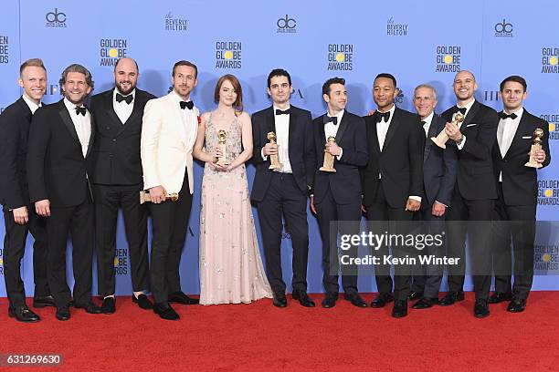 Cast and crew of 'La La Land,' winners of Best Motion Picture - Musical or Comedy, pose in the press room during the 74th Annual Golden Globe Awards...