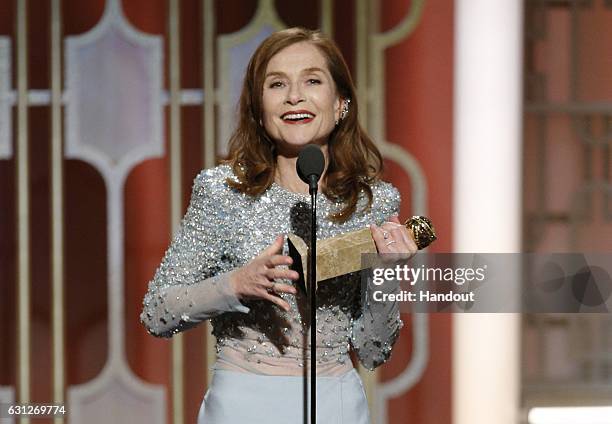 In this handout photo provided by NBCUniversal, Isabelle Huppert accepts the award for Best Actress in a Motion Picture - Drama for her role in...