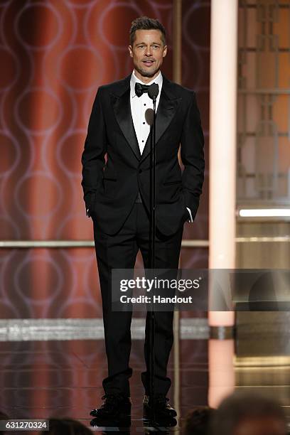 In this handout photo provided by NBCUniversal, presenter Brad Pitt onstage during the 74th Annual Golden Globe Awards at The Beverly Hilton Hotel on...