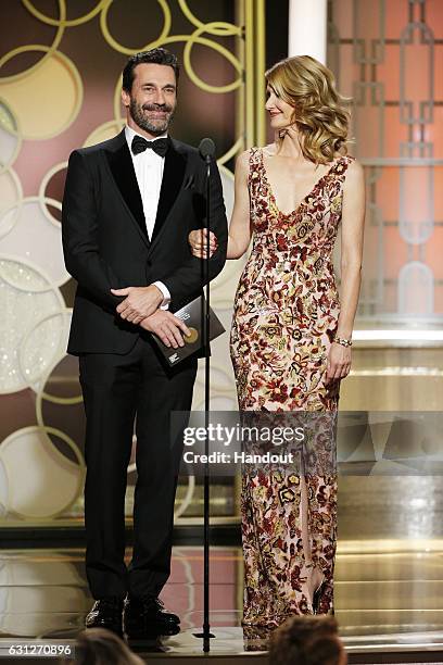 In this handout photo provided by NBCUniversal, presenters Jon Hamm and Laura Dern onstage during the 74th Annual Golden Globe Awards at The Beverly...
