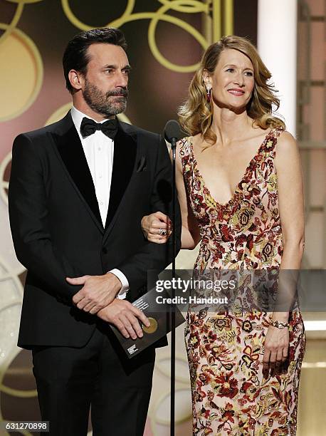 In this handout photo provided by NBCUniversal, presenters Jon Hamm and Laura Dern onstage during the 74th Annual Golden Globe Awards at The Beverly...